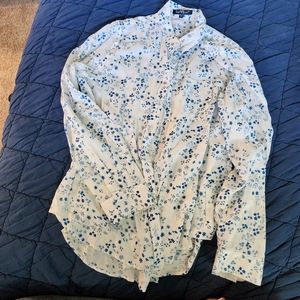 Long sleeved blouse. White with small blue flowers.